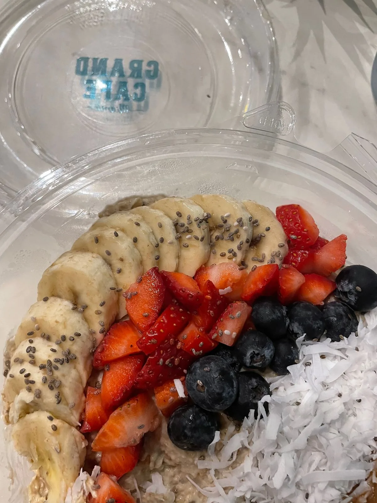 Oatmeal with Berries, Banana, Chia Seeds, and Coconut Flakes